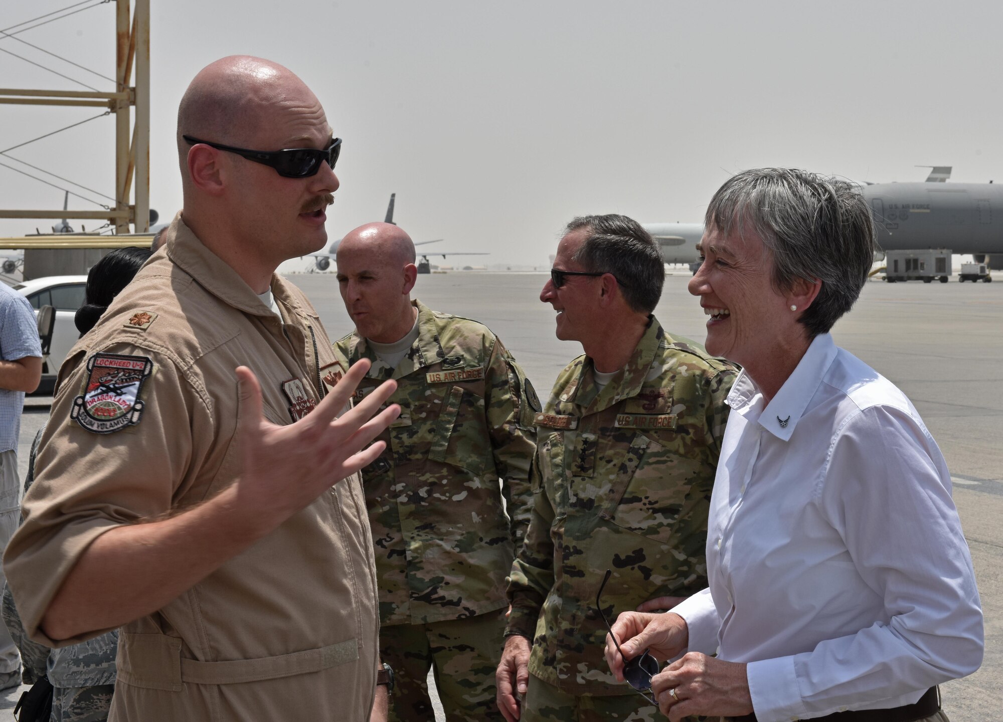 Secretary of the Air Force Heather Wilson shares a laugh with Maj. Kenneth McQueen of the 99th Expeditionary Reconnaissance Squadron during a visit to Al Dhafra Air Base, United Arab Emirates, Aug. 18, 2017.