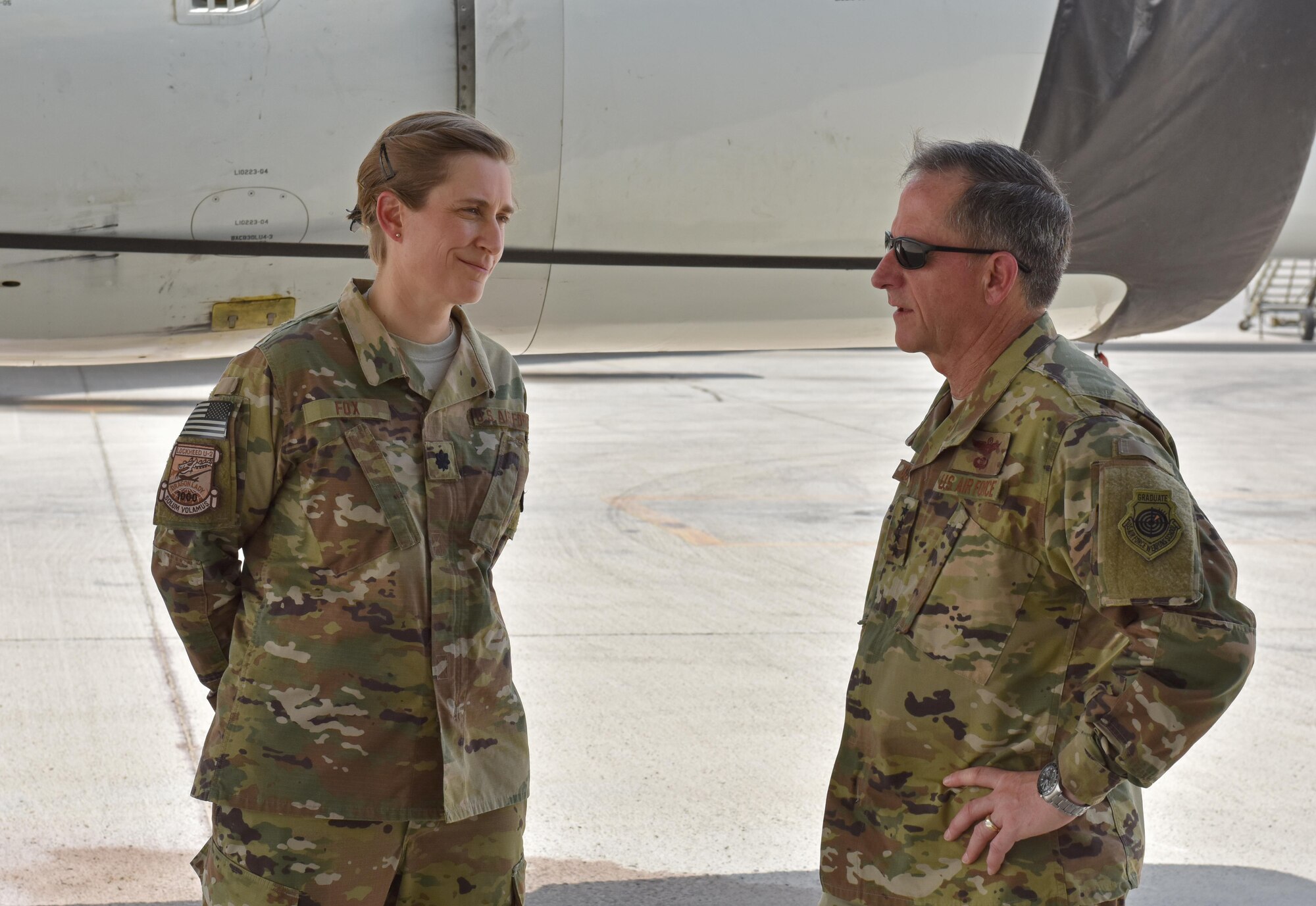 Air Force Chief of Staff Gen. David L. Goldfein speaks with 99th Expeditionary Reconnaissance Squadron Commander Lt. Col. Heather Fox during a visit to Al Dhafra Air Base, United Arab Emirates, Aug. 18, 2017.