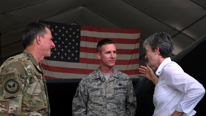 Secretary of the Air Force Heather Wilson, right, and Air Force Chief of Staff Gen. David L. Goldfein, left, speak with Master Sgt. Brandon Holley, 380th Expeditionary Aircraft Maintenance Squadron craftsman,  at Al Dhafra Air Base, United Arab Emirates on Aug. 18, 2017.