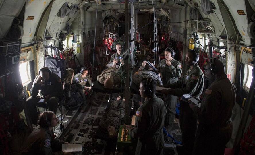 U.S. Airmen assigned to the 86th Aeromedical Evacuation Squadron participate in an aeromedical training mission aboard a C-130J Super Hercules while enroute to Morón Air Base, Spain, Aug. 15, 2017. During the training, the 86th AES Airmen practiced cardiac and respiratory emergencies procedures, aircraft emergencies protocol, and how to handle an irate patient. (U.S. Air Force photo by Senior Airman Tryphena Mayhugh)