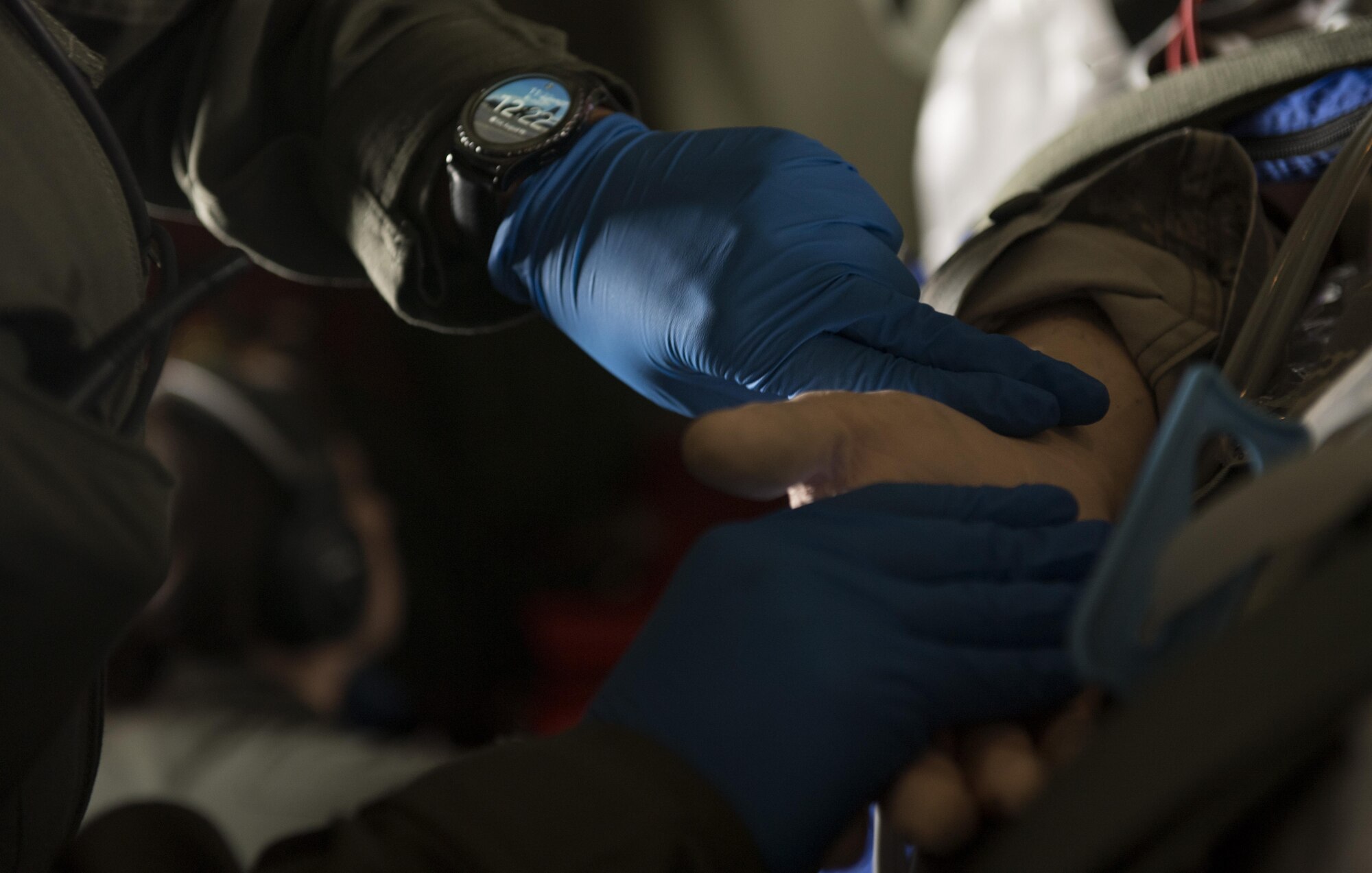 U.S. Air Force Senior Airman Jessica Rey Hakert, 86th Aeromedical Evacuation Squadron aeromedical evacuation technician, checks the pulse of a medical mannequin during a training mission aboard a C-130J Super Hercules flying to Morón Air Base, Spain, Aug. 15, 2017. From Morón, the 86th AES Airmen continued onto Lajes Field, Portugal to carry on their aeromedical training mission. (U.S. Air Force photo by Senior Airman Tryphena Mayhugh)