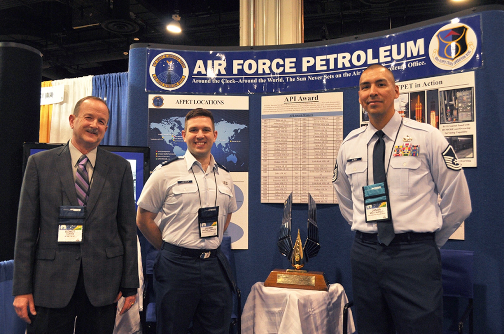 Air Force Petroleum Office representatives stand by booth