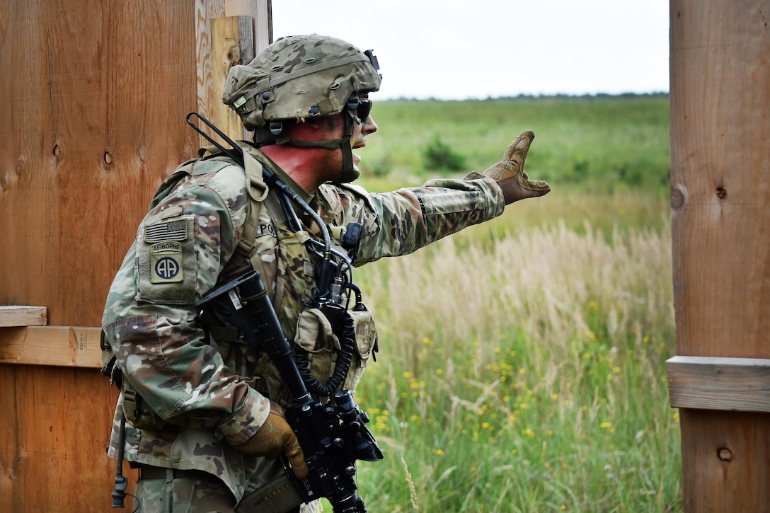 A soldier yells out commands to his team