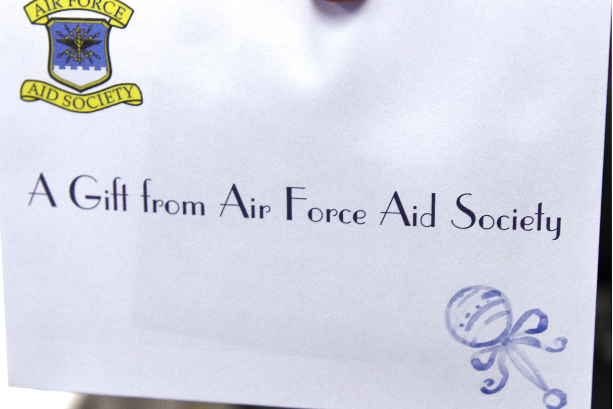 Gail Brown, 23d Force Support Squadron Airman and Family Readiness work life specialist, holds an envelope during the Bundles for Babies event, Aug. 16, 2017, at Moody Air Force Base, Ga. Following the event the Air Force Aid Society presented each participant with a $50 Air Force and Army Exchange gift card. (U.S. Air Force photo by Airman Eugene Oliver)