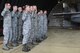 748th Aircraft Maintenance Squadron Airmen raise their hands and recite the crew chief oath in unison at Royal Air Force Lakenheath, England, Aug. 18. Crew chiefs are each assigned an aircraft and tasked to keep it in top flying condition. (U.S. Air Force photo/Senior Airman Abby L. Finkel)