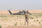 A member of the Iraqi Security Forces establishes a security perimeter around an HH-60M Black Hawk helicopter from the 2-149th General Support Aviation Battalion, Task Force Rough Riders, during the aerial response force exercise at Camp Taji Military Complex, Iraq, August 13,2017. The ISF provided security to an HH-60M Black Hawk helicopter that had been grounded due to simulated maintenance issues. This training is part of the overall Combined Joint Task Force – Operation Inherent Resolve building partner capacity mission which focuses on training and improving the capability of partnered forces fighting ISIS. CJTF-OIR is the global Coalition to defeat ISIS in Iraq and Syria. (US Army Photo by Capt. Stephen James)