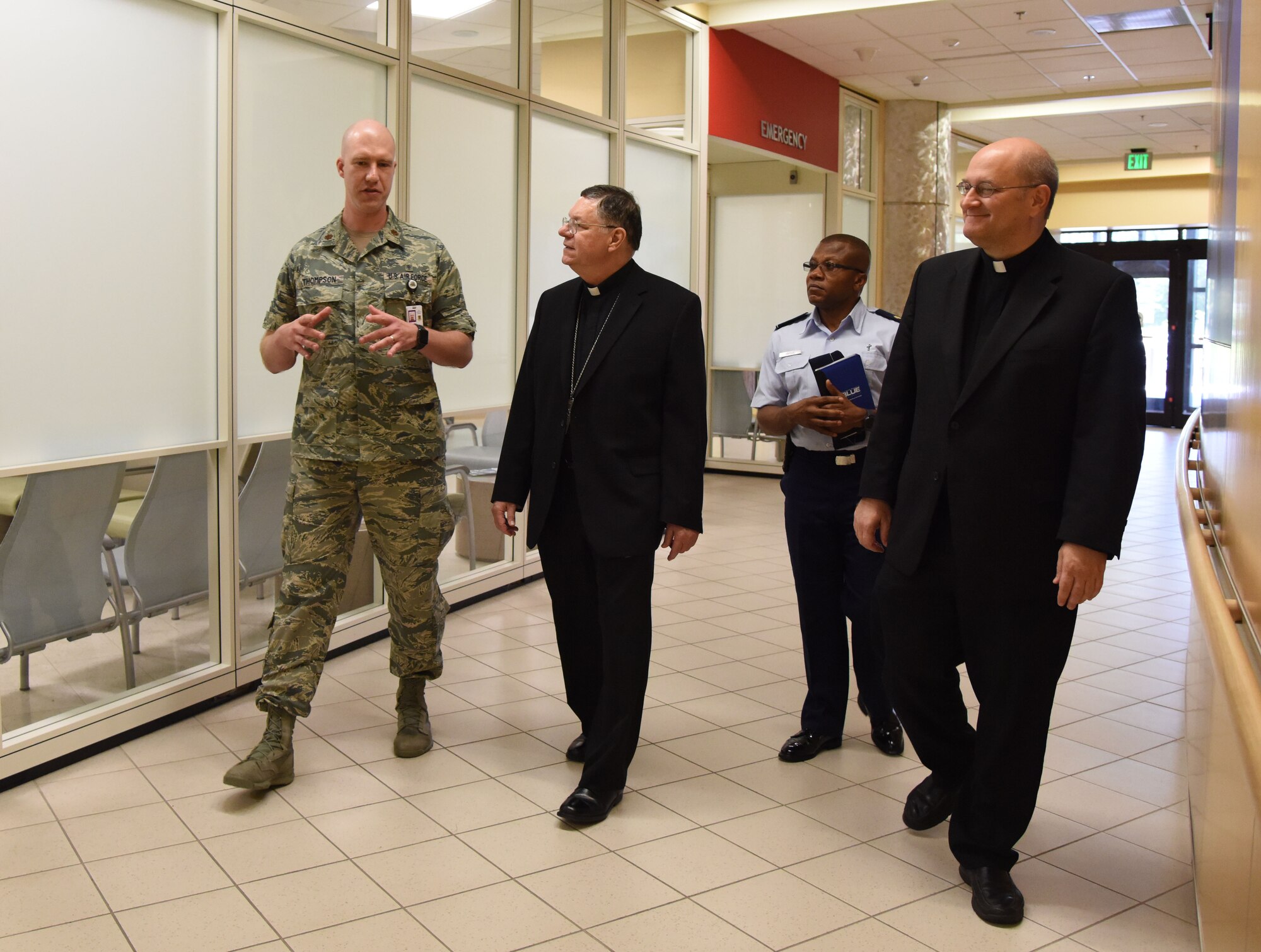 Maj. Jerry Thompson, 81st Medical Group executive officer, provides a tour of the Keesler Medical Center to The Most Reverend Louis Kihneman, III, Bishop of Biloxi Roman Catholic Diocese of Biloxi, and The Very Reverend Monsignor T. Dominick Fullam, J.C. L. Vicar General-Moderator of the Curia Roman Catholic Diocese of Biloxi, Aug. 17, 2017, on Keesler Air Force Base, Miss. The purpose of the visit was to familiarize Bishop Kihneman and Monsignor Fullam with the mission, facilities and faith programs of the 81st Training Wing and the 403rd Wing. Bishop Kihneman also blessed the 403rd’s fleet of C-130J and WC-130J Super Hercules aircraft. (U.S. Air Force photo by Kemberly Groue)