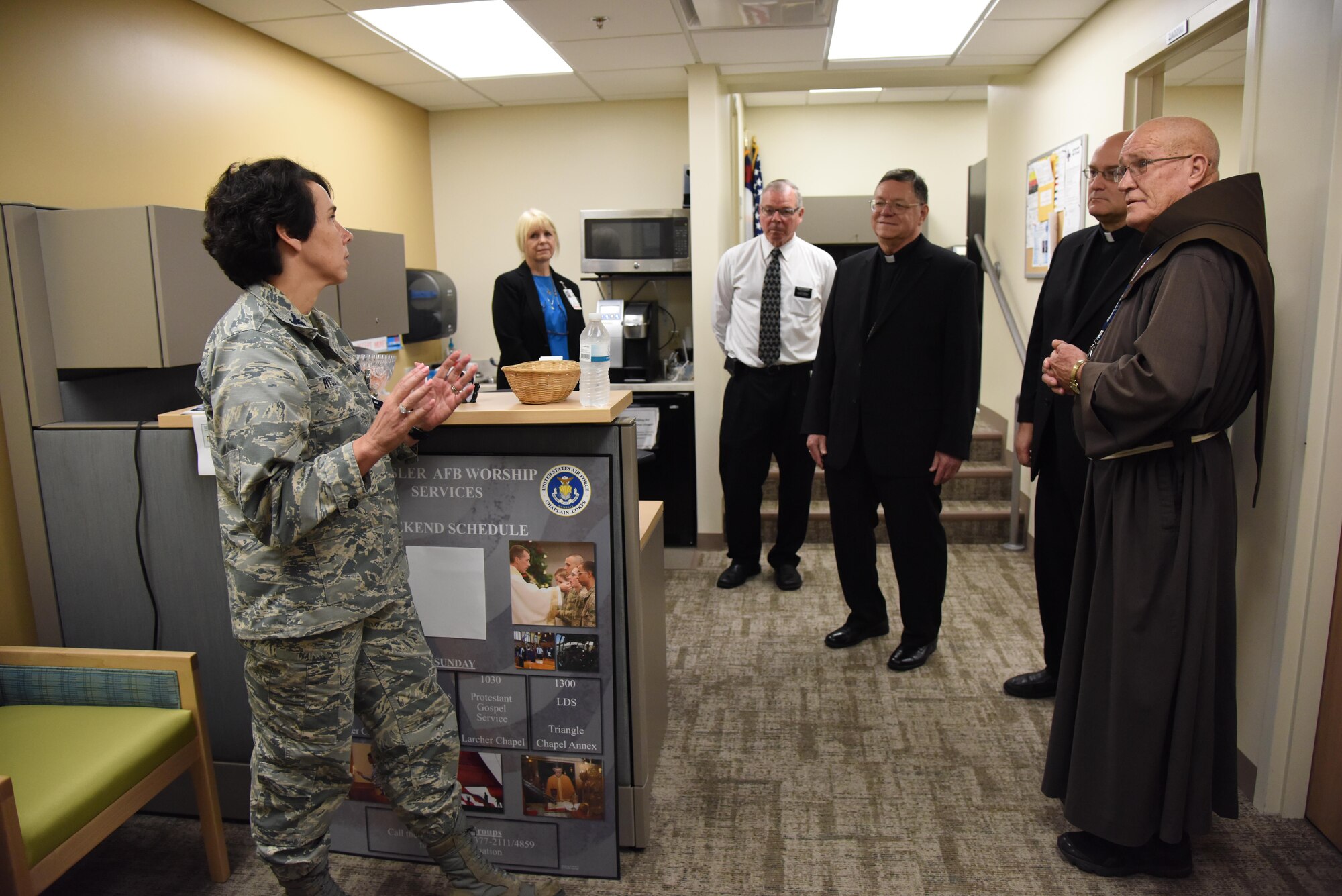 Col. Jeannine Ryder, 81st Medical Group commander, briefs The Most Reverend Louis Kihneman, III, Bishop of Biloxi Roman Catholic Diocese of Biloxi, and The Very Reverend Monsignor T. Dominick Fullam, J.C. L. Vicar General-Moderator of the Curia Roman Catholic Diocese of Biloxi, on the capabilities of the Keesler Medical Center Aug. 17, 2017, on Keesler Air Force Base, Miss. The purpose of the visit was to familiarize Bishop Kihneman and Monsignor Fullam with the mission, facilities and faith programs of the 81st Training Wing and the 403rd Wing. (U.S. Air Force photo by Kemberly Groue)