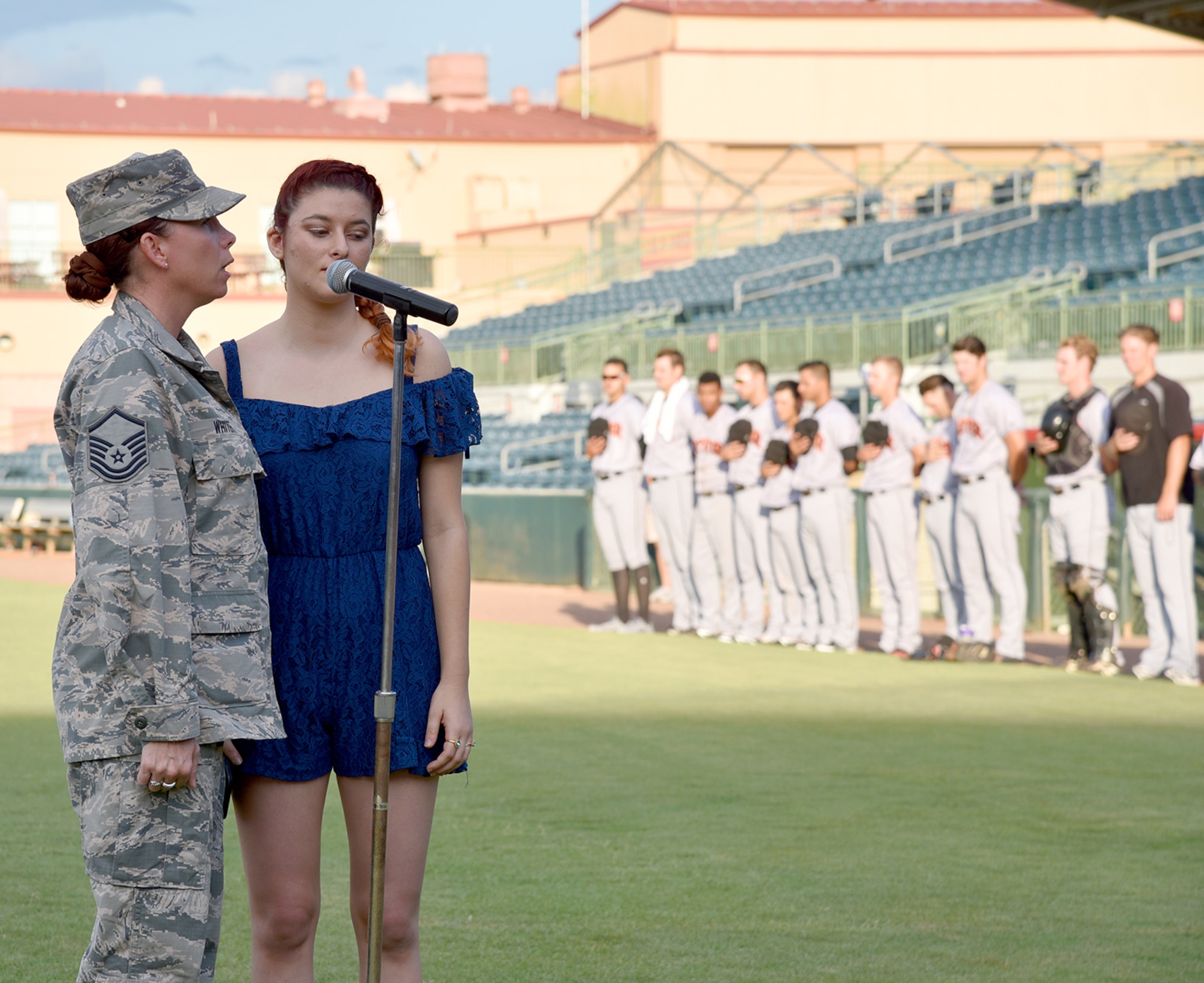 During a Florida Fire Frogs minor league baseball game August 18, 2017, the Patrick Air Force Base Honor Guard presented the colors to honor all military and 1st responders, and to pay special tribute to Senior Airman Kevin Greene, the 920th Rescue Wing’s first single amputee to return to military service after a tragic accident resulted in the amputation of part of his left leg. He attended the game with his little girl and girlfriend. (U.S. Air Force photo/Maj. Cathleen Snow)