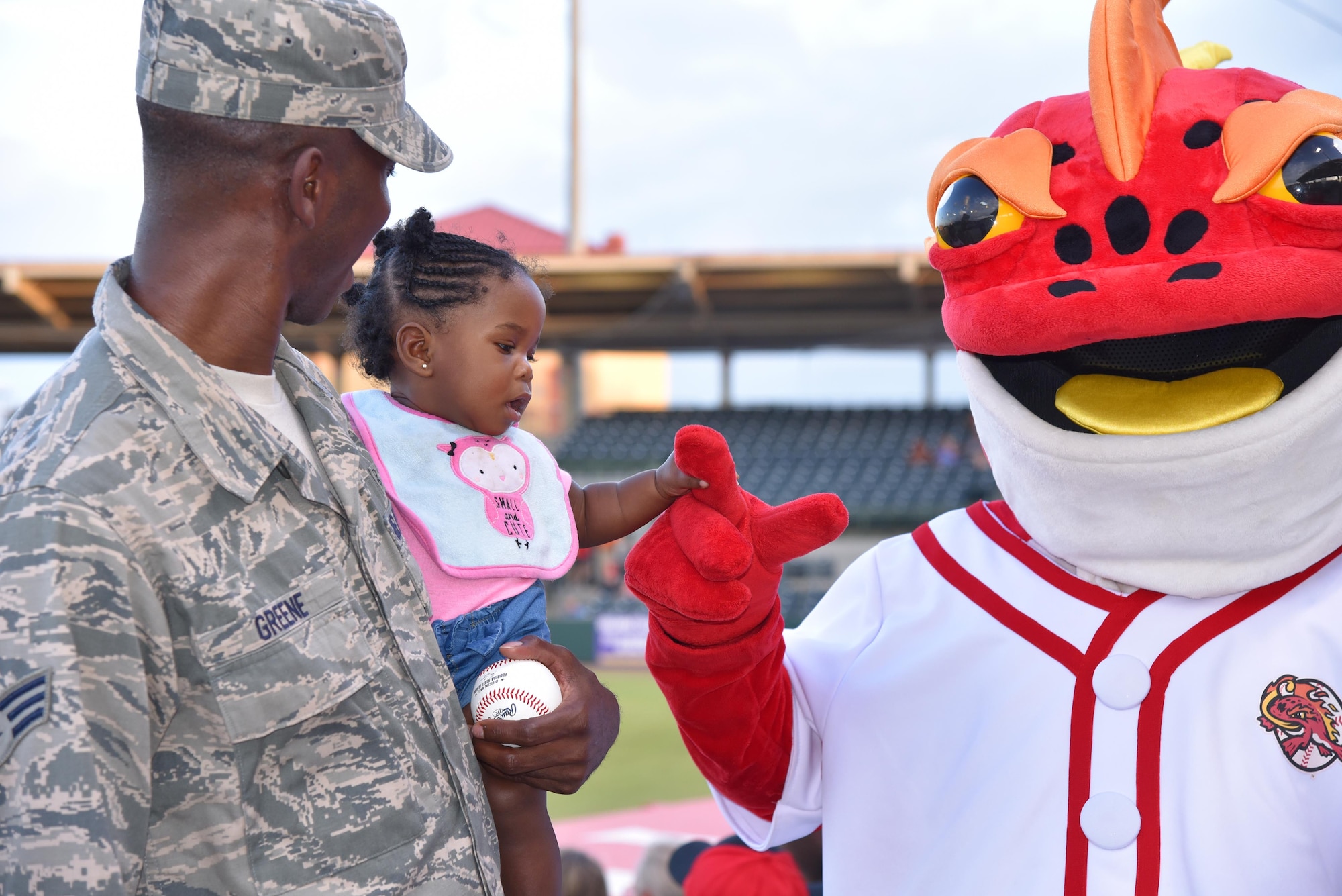 During a Florida Fire Frogs minor league baseball game August 18, 2017, the team not only honored all military and 1st responders, but they took time out to pay special tribute to Senior Airman Kevin Greene, the 920th Rescue Wing’s first single amputee to return to military service after a tragic accident resulted in the amputation of part of his left leg. He attended the game with his little girl and girlfriend. (U.S. Air Force photo/Maj. Cathleen Snow)