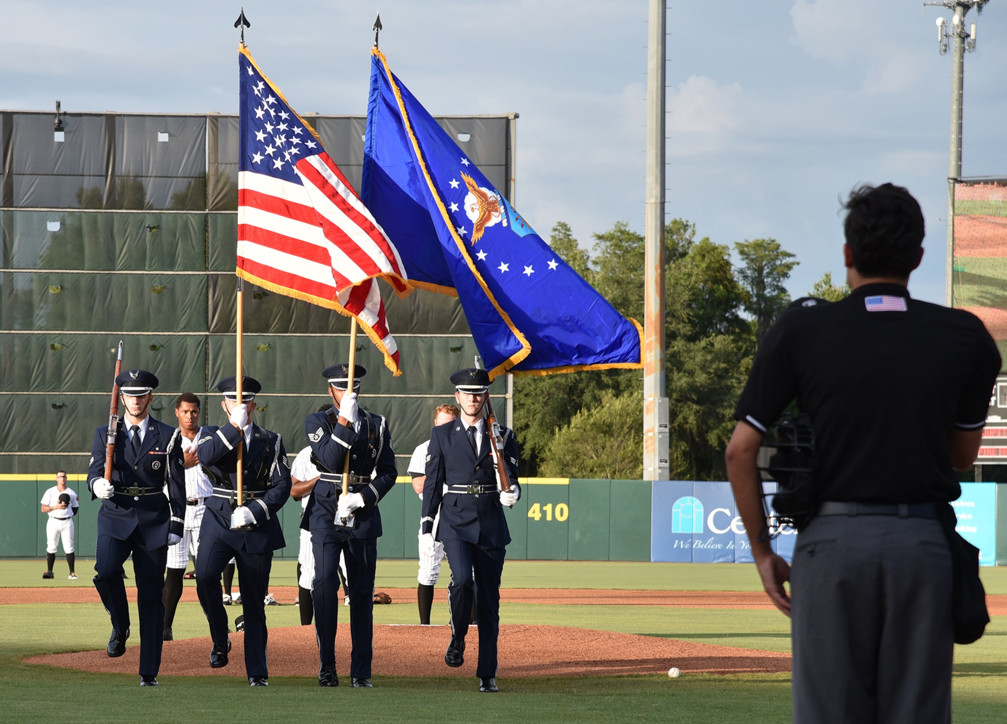 During a Florida Fire Frogs minor league baseball game August 18, 2017, the Patrick Air Force Base Honor Guard presented the colors to honor all military and 1st responders, and to pay special tribute to Senior Airman Kevin Greene, the 920th Rescue Wing’s first single amputee to return to military service after a tragic accident resulted in the amputation of part of his left leg. He attended the game with his little girl and girlfriend. (U.S. Air Force photo/Maj. Cathleen Snow)