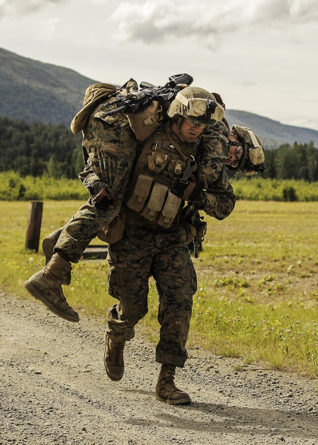 U.S. Marines with 1st Battalion, 25th Marine Regiment, 4th Marine Division, Marine Forces Reserve and members of 1st Squad conduct a timed grenade assault range during the Combat Marksmanship Endurance Test in the Small Arms Complex on Joint Base Elmendorf-Richardson, Alaska, Aug. 8, 2017. The Marines and Sailors tested their abilities to conduct the full spectrum of infantry operations during the competition for the title of 4th Marine Division Super Squad. (U.S. Marine Corps photo by Sgt. Justin A. Bopp/Released)