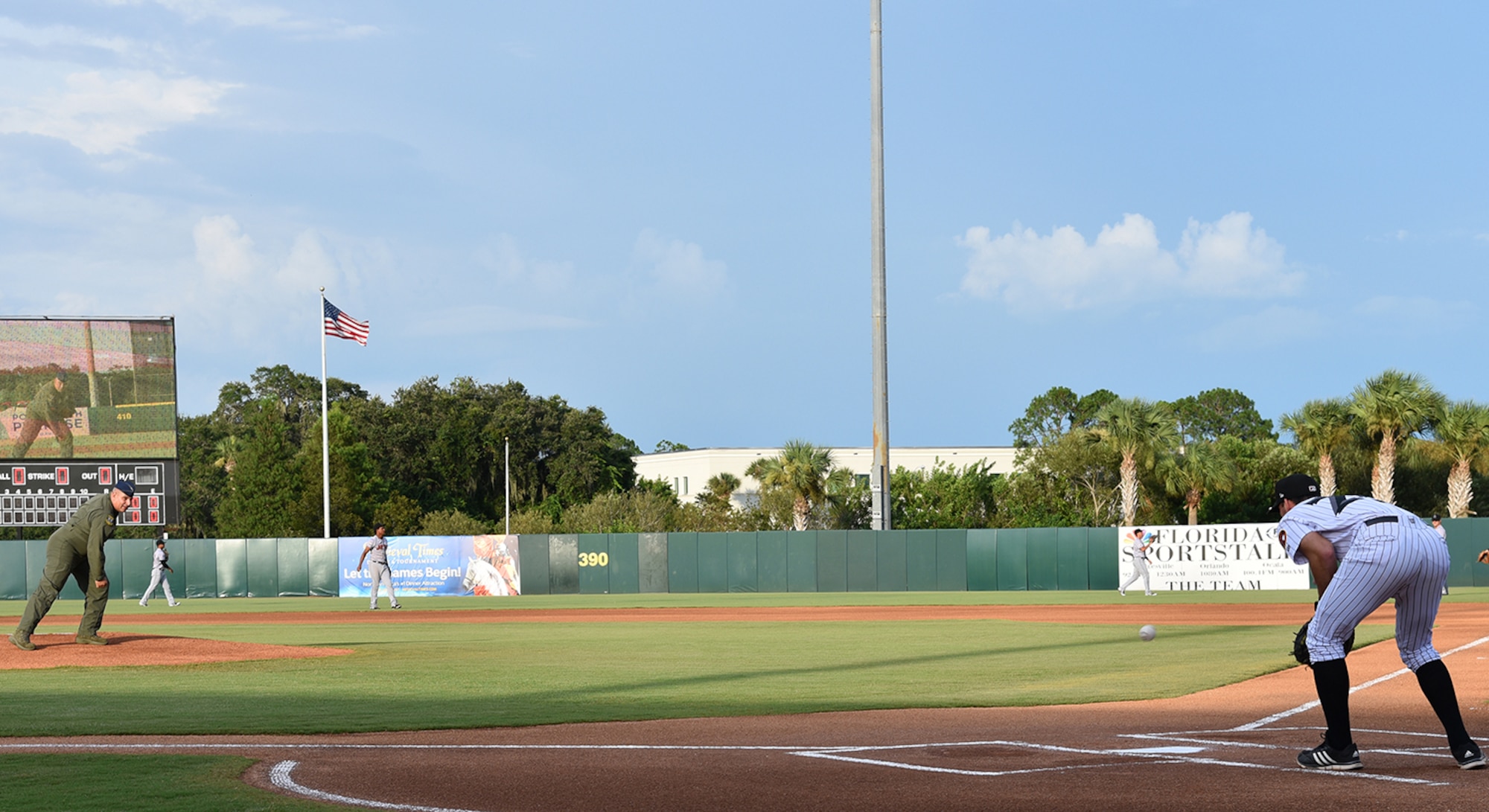 During a Florida Fire Frogs minor league baseball game, Col. Mike 'Yeti' LoForti, 920th Operations Group Commander, threw out the first pitch then the Patrick Air Force Base Honor Guard presented the colors while Master Sgt. Heidi White and her daughter sang the national anthem. The team will not only honored all military and 1st responders, but they took time out to pay special tribute to Senior Airman Kevin Greene, the 920th Rescue Wing’s first single amputee to return to military service after a tragic accident resulted in the amputation of part of his left leg. (U.S. Air Force photo/Maj. Cathleen Snow)