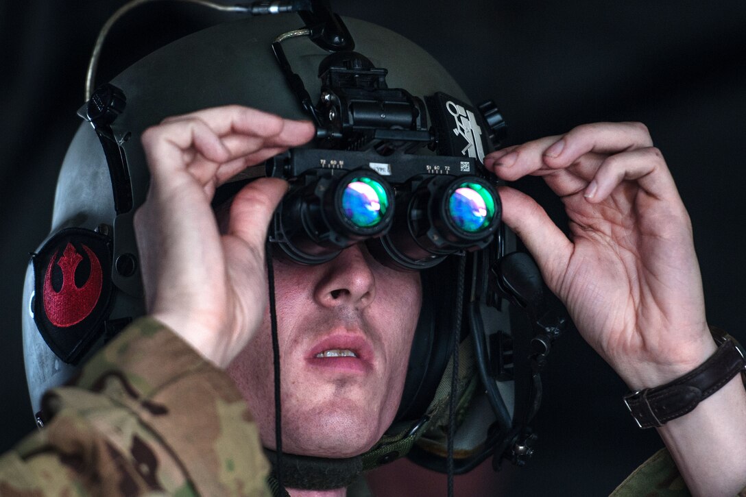 A guardsman checks his night goggles.