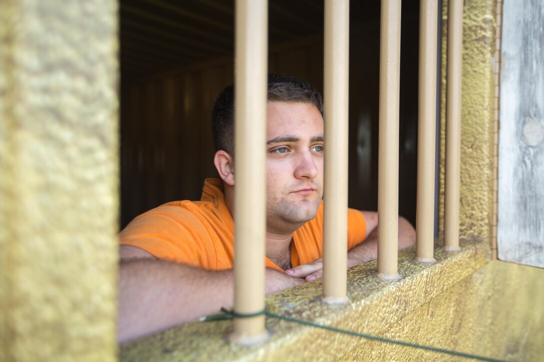 U.S. Army Reserve Soldier Pfc. Shawn Beesley, 800th Military Police Company, role plays as a detainee during Combat Support Training Exercise (CSTX) 86-17-02 at Fort McCoy, Wis., August 18, 2017. CSTX includes more than 12,000 service members from the Army, Navy, Air Force and Marine Corps as well as from six countries. CSTX is a large-scale training event where units experience tactical training scenarios specifically designed to replicate real-world missions. (U.S. Army Reserve photo by Spc. John Russell)