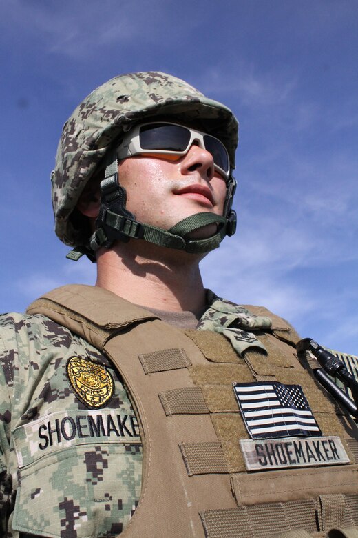 U.S. Navy Petty Officer 2nd Class Zachary Shoemaker waits behind the firing line at Fort Bliss' Range 39 during the Air Force Security Forces Center Desert Defender Ground Combat Readiness Training Center's basic security course heavy weapons fire.