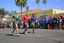The new Marines of Kilo Company, 3rd Recruit Training Battalion, reunite with their loved ones during family day at Marine Corps Recruit Depot San Diego, today.
