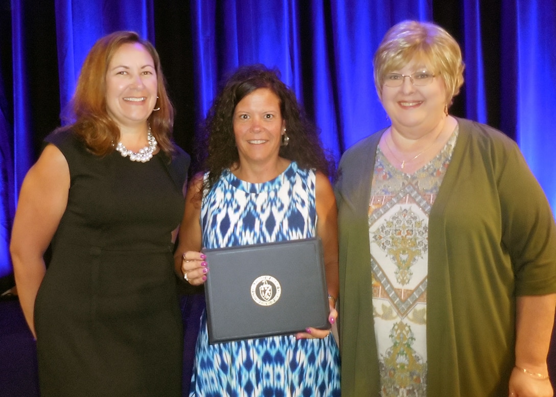 DLA Energy employees pose with their Department of Energy Federal Energy Management Program award