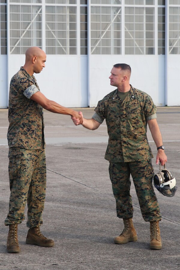 Lt. Col. Brendan Burks, right, recognizes Cpl. Nathan Hall after his “Safety Win of the Week” during an operational reset at Marine Corps Air Station Cherry Point, N.C., Aug. 21, 2017. While conducting maintenance at Marine Aerial Refueler Transport Squadron 252, Hall noticed an irregularity and took the necessary steps to protect the integrity of the KC-130. The squadron conducted the operational reset to focus on fundamentals of safe flight operations, standardization and combat readiness, in keeping with guidance from Gen. Robert Neller, Commandant of the U.S. Marine Corps. Burks is the commanding officer of VMGR-252, Marine Aircraft Group 14, 2nd Marine Aircraft Wing; and Hall is a fixed-wing aircraft mechanic assigned to VMGR-252. (U.S. Marine Corps photo by Pfc. Cody Rowe/ Released)