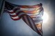 The base flag flaps across the sun as the solar eclipse begins Aug. 21 at Eglin Air Force Base, Fla.  (U.S. Air Force photo/Samuel King Jr.)