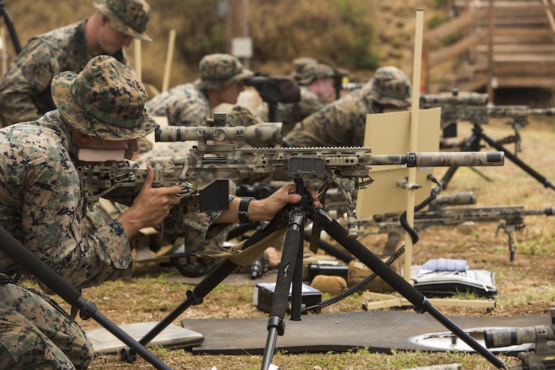 Scout sniper candidates with Weapons Company, 2nd Battalion, 3rd Marine Regiment, aim down range during a pre-scout sniper course at Pu’uloa Range Training Facility aboard Marine Corps Base Hawaii, August 14, 2017. The known distance qualification course involves firing at moving targets from the 300, 500, and 600 yard lines; engaging “stop and go” and “bobber” targets at the 700 and 800; shooting from the maximum range of 1,000 yards, and is designed to enhance the Marines’ capabilities to engage targets at known distances and alternate positions. (U.S. Marine Corps photo by Lance Cpl. Isabelo Tabanguil)