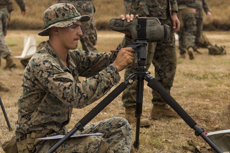 Cpl. Austin Cappelletti, a scout sniper candidate with Weapons Company, 2nd Battalion, 3rd Marine Regiment, prepares a spotting scope during a pre-scout sniper course at Pu’uloa Range Training Facility aboard Marine Corps Base Hawaii, August 14, 2017. Spotters help the sniper account for wind, elevation, atmospherics and observe the placement of the last shot the shooter fired. The known distance qualification course is designed to enhance the Marines’ capabilities to engage targets at known distances and alternate positions. (U.S. Marine Corps photo by Lance Cpl. Isabelo Tabanguil)