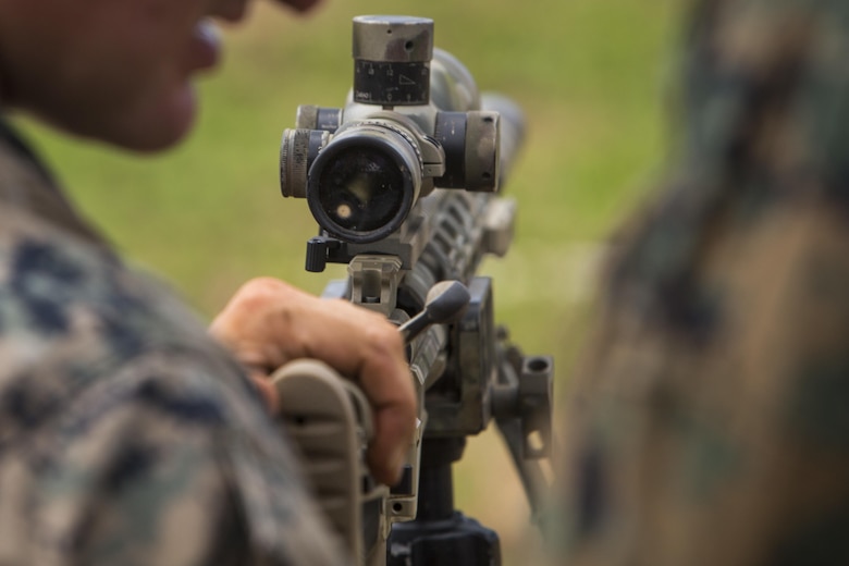 Scout sniper candidates with Weapons Company, 2nd Battalion, 3rd Marine Regiment, prepare to fire an M40A6 sniper rifle during a pre-scout sniper course at Pu’uloa Range Training Facility aboard Marine Corps Base Hawaii, August 14, 2017. The known distance qualification course involves firing at moving targets from the 300, 500, and 600 yard lines; engaging “stop and go” and “bobber” targets at the 700 and 800; shooting from the maximum range of 1,000 yards, and is designed to enhance the Marines’ capabilities to engage targets at known distances and alternate positions. (U.S. Marine Corps photo by Lance Cpl. Isabelo Tabanguil)