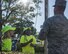 Kadyn Falk, left and Kamyiah Hawthorne, both fourth graders and members of Eglin Elementary School’s safety patrol, help Staff Sgt. Michael Stanolevich, 96th Medical Group Honor Guardsman, prepare to raise the flag before class at Eglin Air Force Base, Fla. Aug. 15.  The HG made a visit to the school to train the safety patrol how to properly handle the flag during their daily flag detail. (U.S. Air Force photo/Ilka Cole)