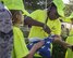 Kamyiah Hawthorne, Eglin Elementary School safety patrol member, fastens the flag during Honor Guard flag detail training before class at Eglin Air Force Base, Fla. Aug. 15. The HG made a visit to the school to train the safety patrol how to properly handle the flag during their daily flag detail. (U.S. Air Force photo/Ilka Cole)