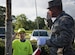 Staff Sgt. Michael Stanolevich, 96th Medical Group Honor Guardsman, teaches Michael King, Eglin Elementary School safety patrol member how to salute during Honor Guard flag detail training before class at Eglin Air Force Base, Fla. Aug. 15.  The HG made a visit to the school to train the safety patrol how to properly handle the flag during their daily flag detail. (U.S. Air Force photo/Ilka Cole)