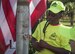 Kamyiah Hawthorne, Eglin Elementary School safety patrol member, raises the flag during Honor Guard flag detail training before class at Eglin Air Force Base, Fla. Aug. 15. The HG made a visit to the school to train the safety patrol how to properly handle the flag during their daily flag detail. (U.S. Air Force photo/Ilka Cole)