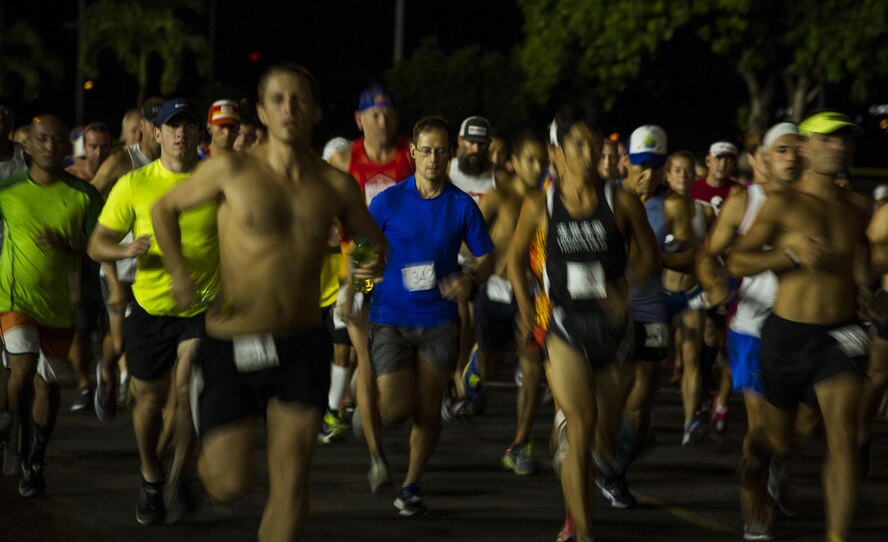 Runners take off at the start of the 11th Annual Hickam Half Marathon, Joint Base Pearl Harbor-Hickam, Hawaii, Aug. 19, 2017.