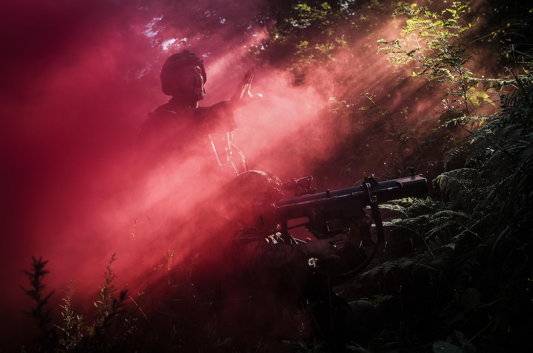 U.S. Marine Corps 1st Lt. Harry J. D. Walker, left, a Brookline, Mass., native and a platoon commander assigned to Charlie Company, 1st Battalion, 3rd Marine Regiment, communicates with his platoon while taking simulated fire during Korean Marine Exchange Program (KMEP) 17-14 on the North West Islands, Republic of Korea, August 11, 2017. KMEP 17-14 enables the Republic of Korea and U.S. Marines to focus on exchanging tactics, procedures, and increasing interoperability. The Hawaii-based battalion is forward deployed to Japan as part of the Unit Deployment Program. (U.S. Marine Corps photo by Cpl. Aaron S. Patterson)
