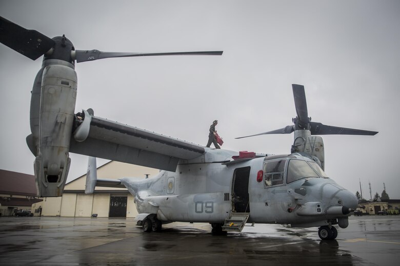 A U.S. Marine maintains a MV-22 Osprey at Misawa Air Base, Japan, August 9, 2017, signifying the start of exercise Northern Viper 2017.