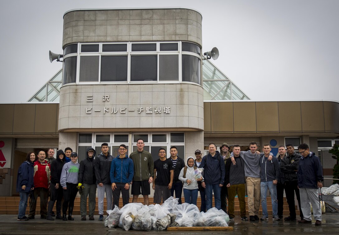 Service members devote their morning to picking up trash at Miss Veedol Beach, Misawa, Japan, August 19, 2017, during Exercise Northern Viper 2017. Marines, Sailors, Airmen banded together with Misawa City employees to participate in the beach cleanup. NV17 tests the interoperability and bilateral capability of the Japan Ground Self-Defense Force and U.S. Marine Corps forces to enhance regional cooperation between participating nations to collectively deter security threats. (U.S. Marine Corps photo by Lance Cpl. Andy Martinez)