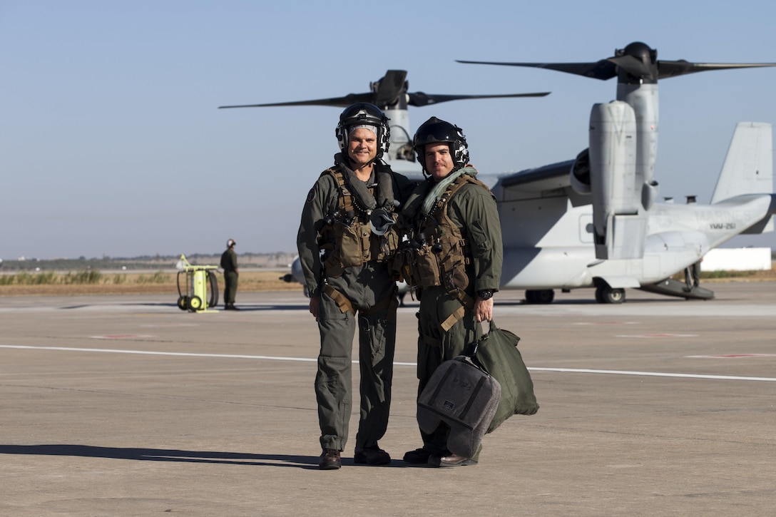 Major Gen. Russell A. Sanborn, left, the commander of Marine Forces Europe and Africa, poses with Maj. Pascal J. Gonzalez, a MV-22B Osprey pilot assigned to Special Purpose Marine Air-Ground Task Force-Crisis Response-Africa, at Morón Air Base, Spain, Aug. 9, 2017. SPMAGTF-CR-AF deployed to conduct limited crisis-response and theater-security operations in Europe and North Africa. (U.S. Marine Corps Photo by 1st Lt. Alexandra Bello)