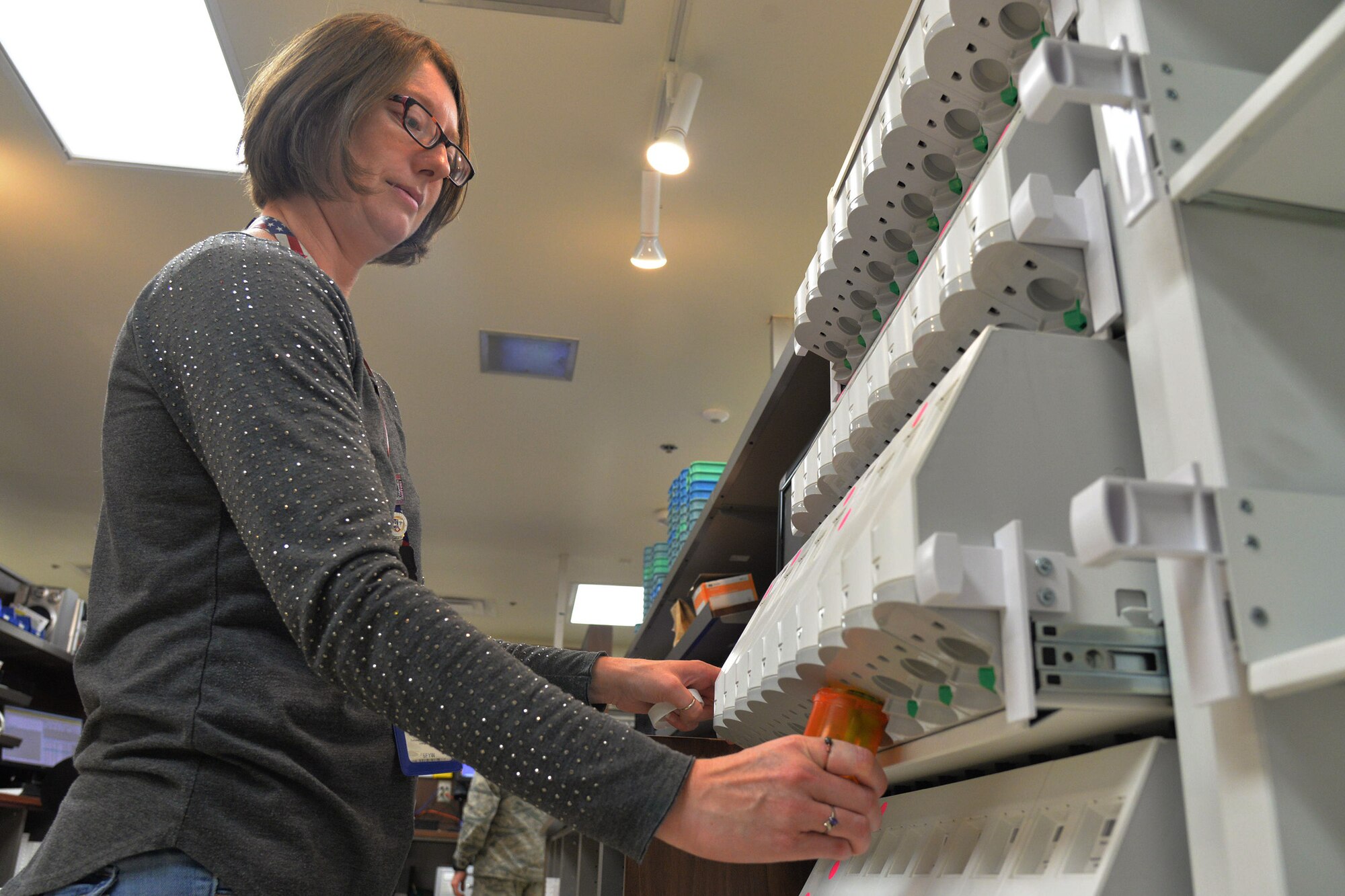 Jessica Gaines, 341st Medical Support Squadron pharmacy technician, fills a prescription using an automated drug dispensing cabinet Aug. 14, 2017, at Malmstrom Air Force Base, Mont.