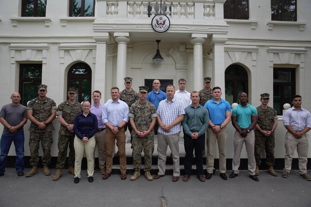 U.S. Marines and sailor with Black Sea Rotational Force 17.1 and Marine Rotational Force Europe 17.1 pose in front of the U.S. Embassy Chisinau with embassy personnel in Chisinau, Moldova, July 15, 2017. (U.S. Marine Corps photo by Sgt. Patricia A. Morris)