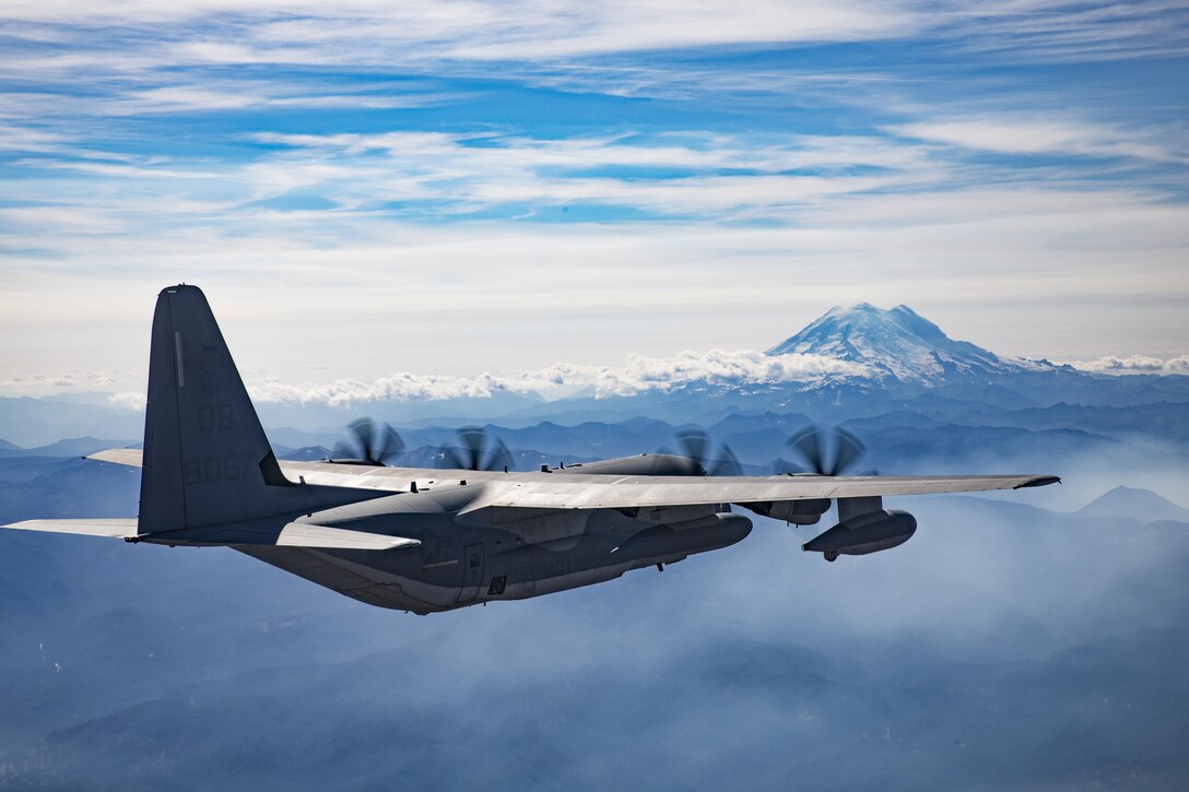 A U.S. Marine Corps KC-130J Hercules aircraft with Marine Aerial Refueler Transport Squadron (VMGR) 352, conducts division tactical navigation training with VMGR-152 as part of unit-level training Evergreen at Naval Air Station Whidbey Island, Washington, Aug. 18, 2017. Division tactical navigation training allows the squadrons’ aircraft to perform gear drops in close proximity to a single location, which enhances operational efficiency. Evergreen will serve as VMGR-152’s 2017 Marine Corps Combat Readiness Evaluation through tri-lateral training with the U.S. Army 160th Special operations Aviation Regiment and U.S. Army 1st Special Forces Group to gain valuable insight on the most recent Operation Inherent Resolve assault-support tactics. (U.S. Marine Corps photo by Cpl. Joseph Abrego)