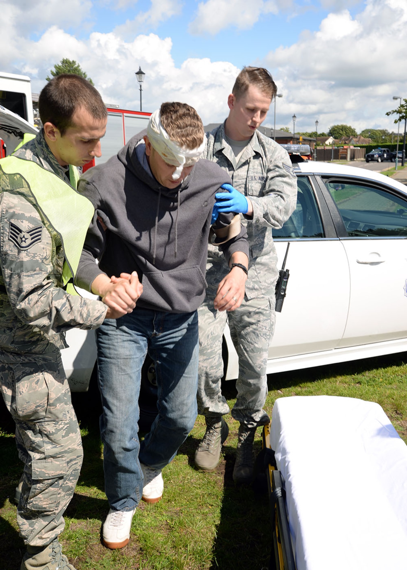 U.S. Airmen from the 48th Medical Group aid a simulated casualty during a mock active shooter exercise at the bowling alley Aug. 17, 2017, on RAF Mildenhall, England. The base regularly conducts exercises to test its preparedness for emergency and disaster response, training procedures and ensure there are no gaps in training. (U.S. Air Force photo by Karen Abeyasekere)