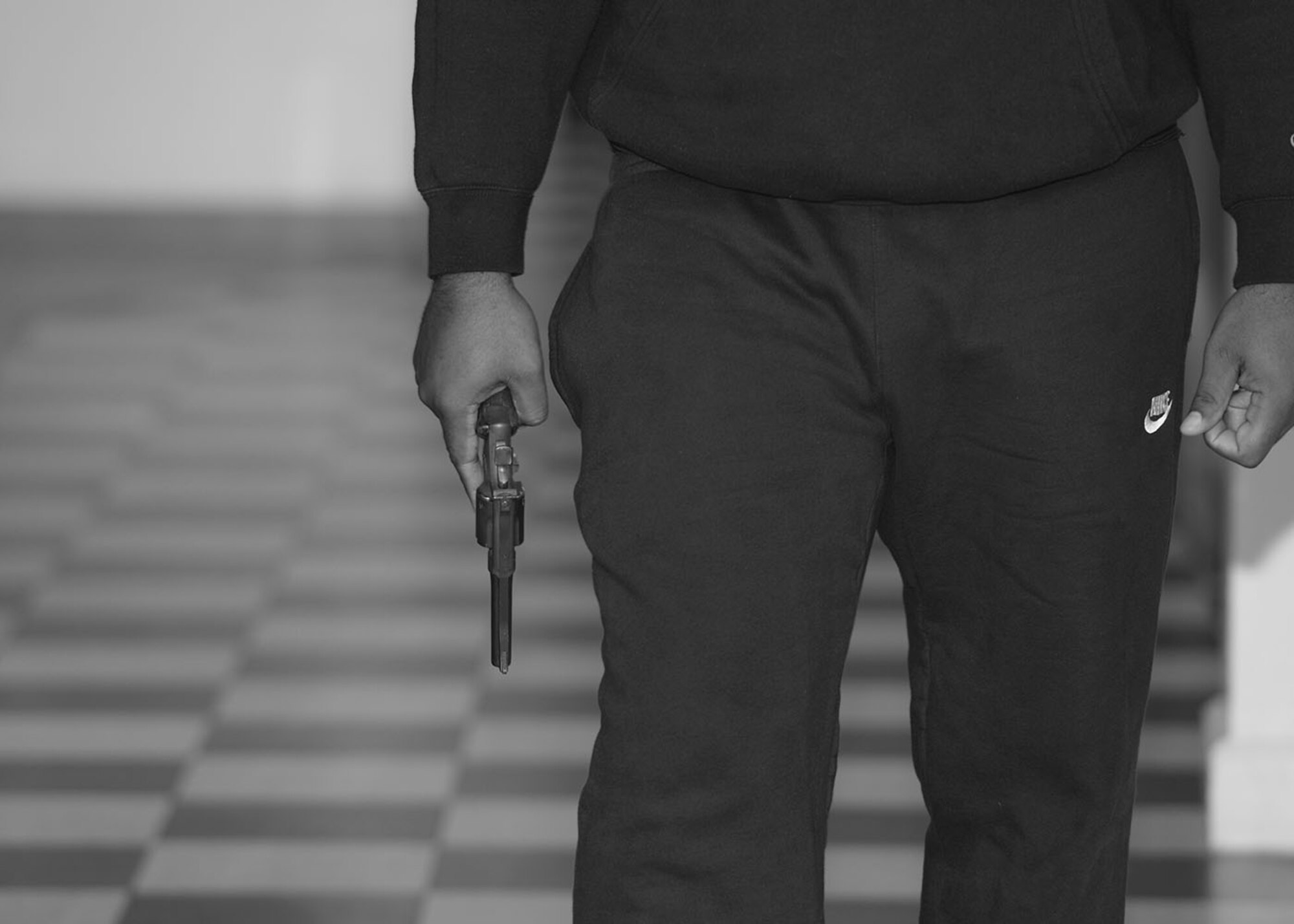 A U.S. Air Force Airman from the 100th Security Forces Squadron simulates being an active shooter during an exercise Aug. 17, 2017, on RAF Mildenhall, England. Team Mildenhall regularly conducts a variety of exercises throughout the year to give Airmen the opportunity to test their capabilities in a realistic situation, as well as testing the response of others. (U.S. Air Force photo by Karen Abeyasekere)