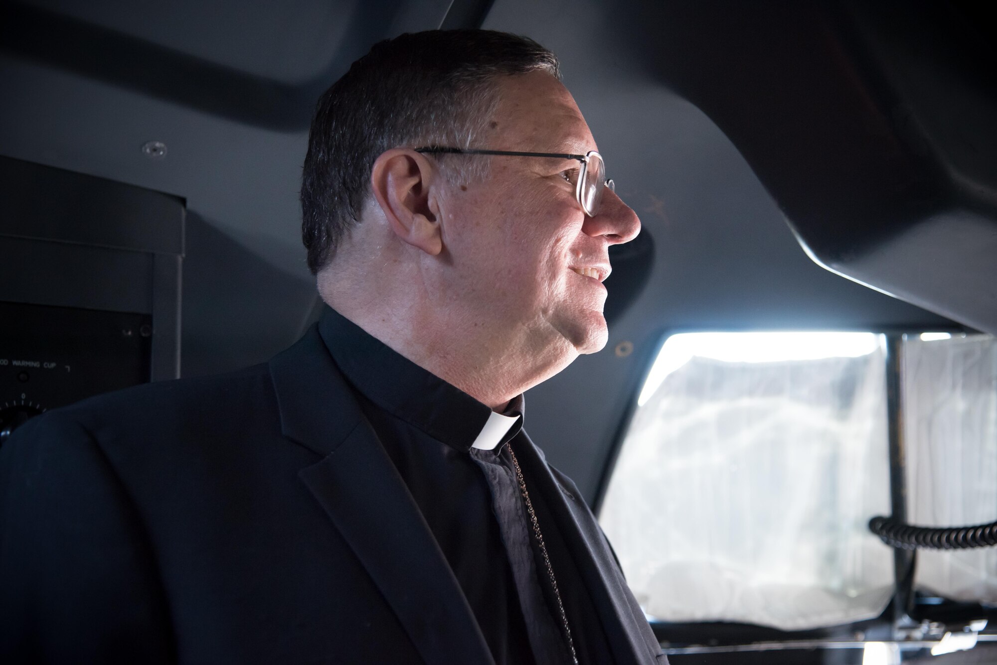 The Bishop of Biloxi, Bishop Louis Kihneman, looks around the flight deck of a WC-130J Super Hercules aircraft Aug. 17, 2017 at Keesler Air Force Base, Mississippi. Kihneman visited the 403rd Wing to learn more about its mission and during his visit took a moment to bless the wing's fleet of aircraft.  (U.S. Air Force photo/Staff Sgt. Heather Heiney)