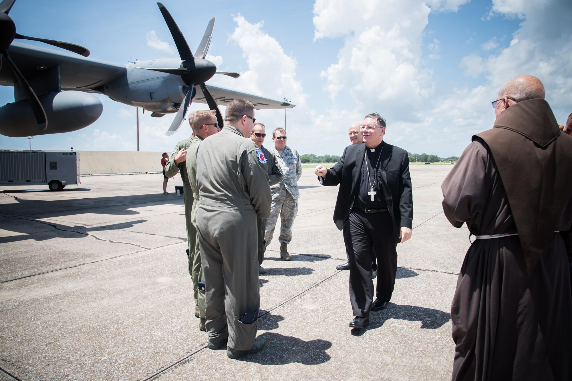 The Bishop of Biloxi, Bishop Louis Kihneman, blesses the 403rd Wing's fleet of aircraft Aug. 17, 2017 at Keesler Air Force Base, Mississippi. Kihneman visited the 403rd Wing to learn more about its mission. (U.S. Air Force photo/Staff Sgt. Heather Heiney)