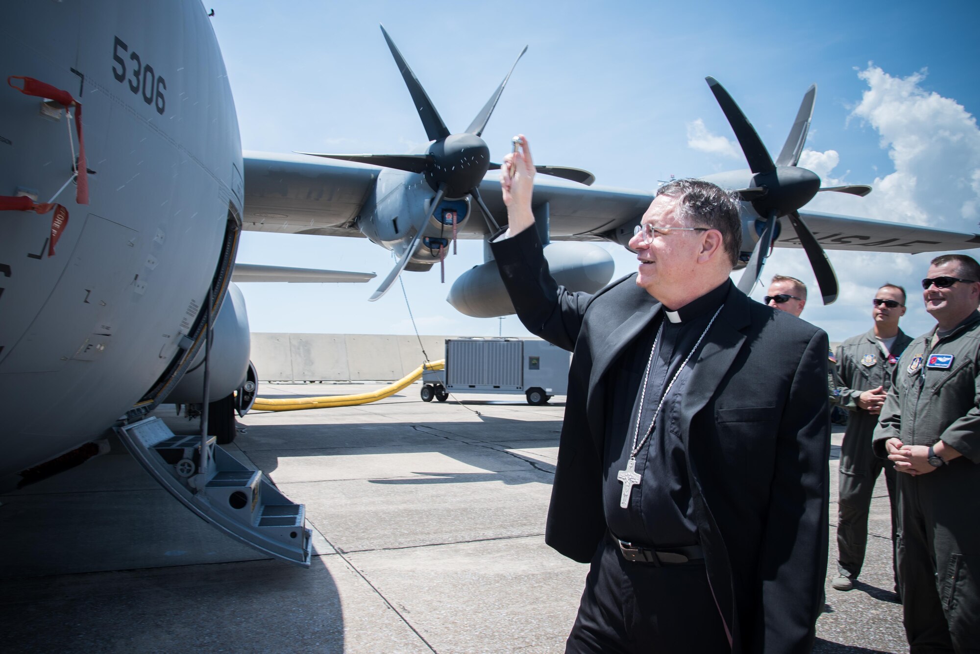 The Bishop of Biloxi, Bishop Louis Kihneman, blesses the 403rd Wing's fleet of aircraft Aug. 17, 2017 at Keesler Air Force Base, Mississippi. Kihneman visited the 403rd Wing to learn more about its mission. (U.S. Air Force photo/Staff Sgt. Heather Heiney)
