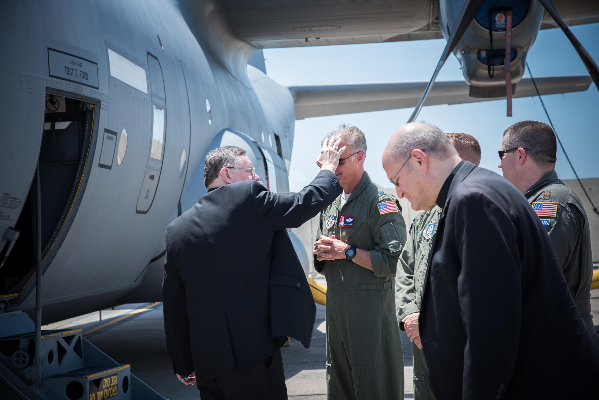 The Bishop of Biloxi, Bishop Louis Kihneman, blesses the 403rd Wing's fleet of aircraft Aug. 17, 2017 at Keesler Air Force Base, Mississippi. Kihneman visited the 403rd Wing to learn more about its mission. (U.S. Air Force photo/Staff Sgt. Heather Heiney)