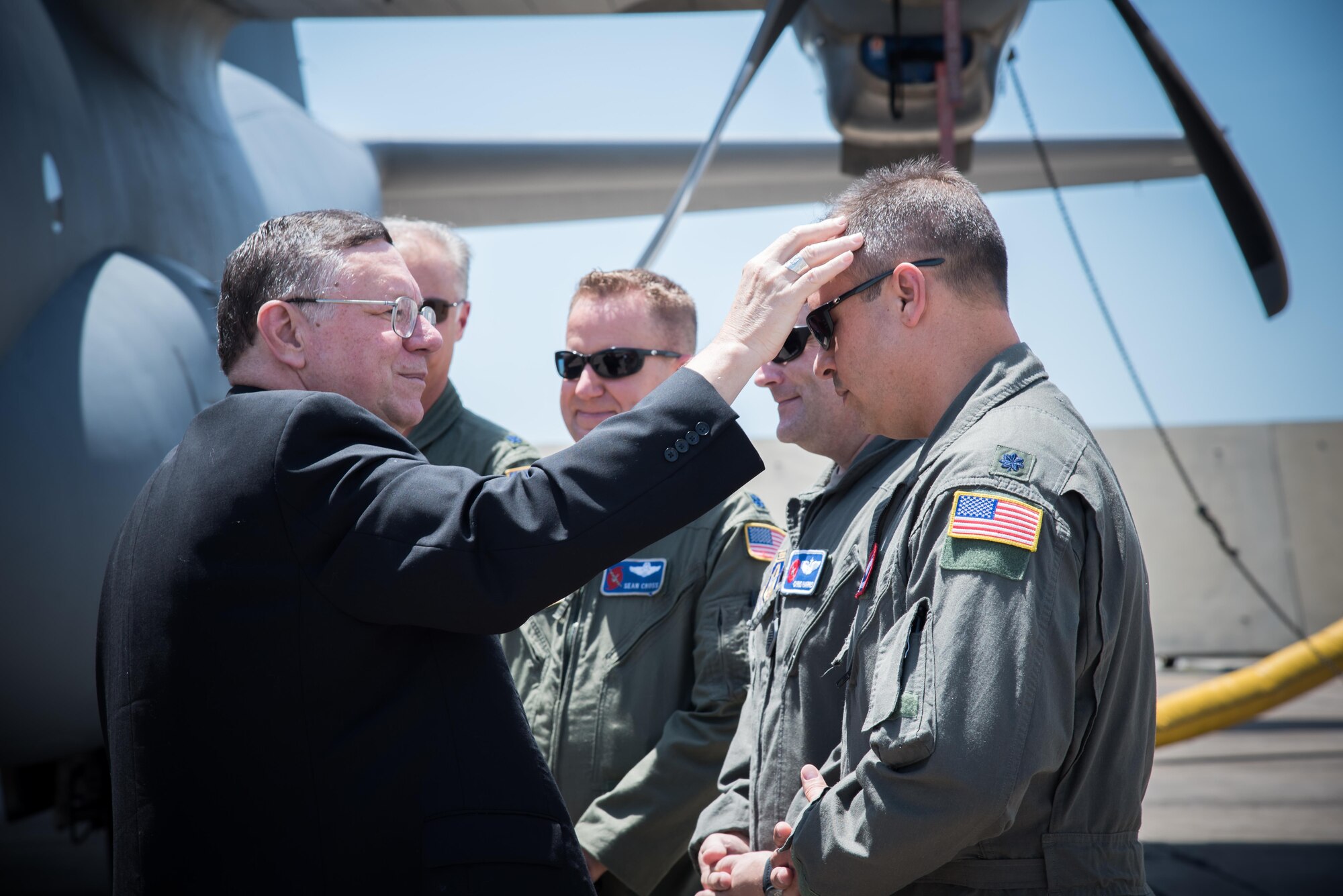 The Bishop of Biloxi, Bishop Louis Kihneman, blesses the 403rd Wing's fleet of aircraft Aug. 17, 2017 at Keesler Air Force Base, Mississippi. Kihneman visited the 403rd Wing to learn more about its mission. (U.S. Air Force photo/Staff Sgt. Heather Heiney)