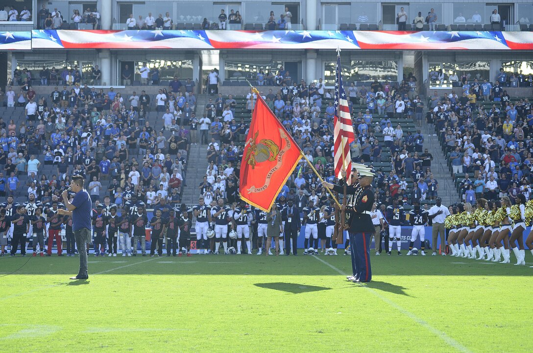U.S. Marines of Marine Corps Recruiting Station Orange County present the colors during the National Anthem presentation at the Stub Hub Center in Carson, Calif., Aug. 20, 2017. The Color Guard supported the Los Angeles Chargers vs. the New Orleans Saints pre-season game to show support for their local football team and more importantly the community. (U.S. Marine Corps photo by Sgt. Jessica Quezada)