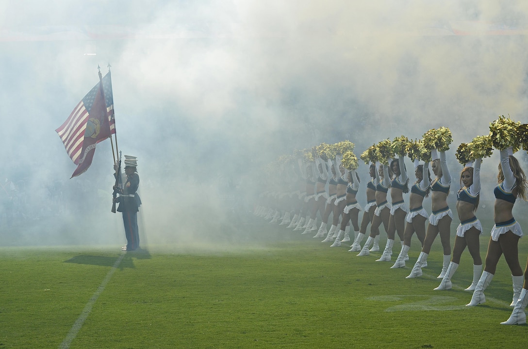 U.S. Marines of Marine Corps Recruiting Station Orange County present the colors during the National Anthem presentation at the Stub Hub Center in Carson, Calif., Aug. 20, 2017. The Color Guard supported the Los Angeles Chargers vs. the New Orleans Saints pre-season game to show support for their local football team and more importantly the community. (U.S. Marine Corps photo by Sgt. Jessica Quezada)