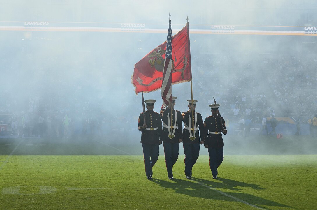 From left to right, Marine Corps Sgt. Herbert Cosio, Sgt. Austin Elder, Sgt. Michael Thomas and Sgt. Martin Minner retire the colors during a Los Angeles Chargers and New Orleans Saints pre-season game at the Stub Hub Center in Carson, Calif., Aug. 20, 2017. Marines of Marine Corps Recruiting Station Orange County presented a Color Guard for their local football team to support the players and more importantly the community. (U.S. Marine Corps photo by Sgt. Jessica Quezada)