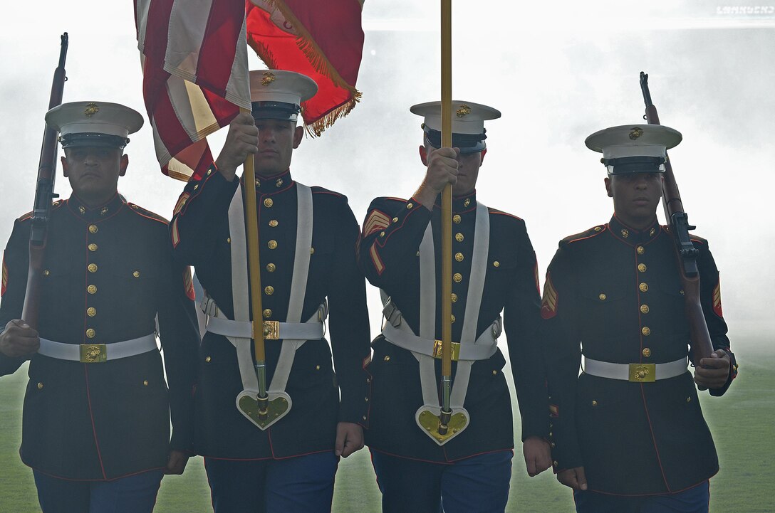 From left to right, Marine Corps Sgt. Herbert Cosio, Sgt. Austin Elder, Sgt. Michael Thomas and Sgt. Martin Minner retire the colors during a Los Angeles Chargers and New Orleans Saints pre-season game at the Stub Hub Center in Carson, Calif., Aug. 20, 2017. Marines of Marine Corps Recruiting Station Orange County presented a Color Guard for their local football team to support the players and more importantly the community. (U.S. Marine Corps photo by Sgt. Jessica Quezada)